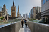 Opening up the foyer to the rooftop allows natural light to make its way deep into the building, while providing views over  Melbourne. Photography © Peter Bennetts c/o Hassell.
