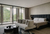 The Junior Master Suite bedroom with views over the surrounding landscape.
